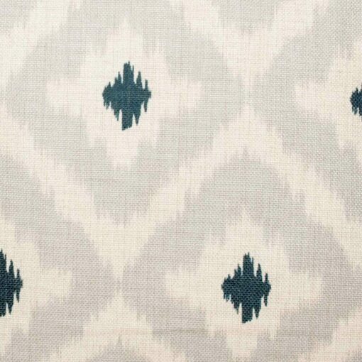 closer look at cushion cover with Neutral Hues Ikat pattern.