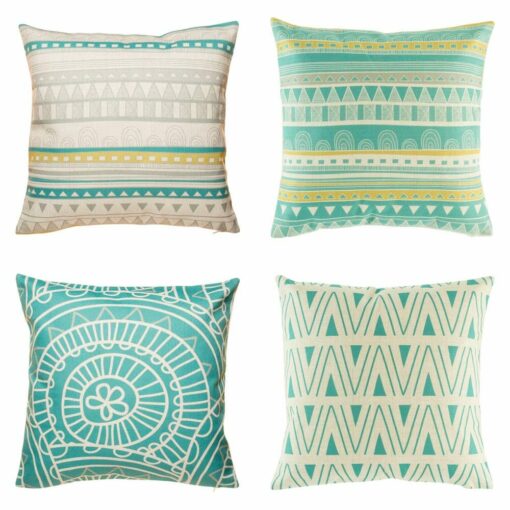 4 cushion with aztec, twirl and wave patterns in teal and white colours.