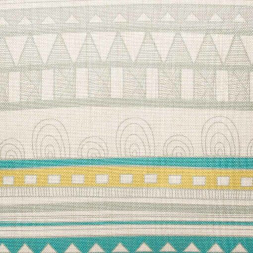 closer look at cushion cover with Grey and Teal Aztec pattern.