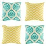 4 cushion cover with ikat and chevron prints in Teal and Yellow colours.