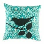 cushion cover with Teal Ikat and Black Bird pattern.