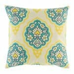 cushion cover with Yellow and Teal Ikat pattern.