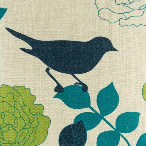 closer look at cushion cover with Teal and Black Bird print.