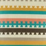 closer look at cushion with Teal and Mustard Aztec pattern.