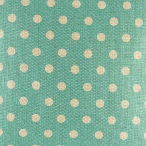 closer look at cushion with Teal and White Polka Dots pattern.