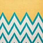 closer look at cushion with Mustard and Blue Chevron pattern.