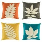 four cushion cover with fern prints in orange,yellow,black and blue colours.