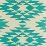 closer look at cushion cover with Teal Ikat pattern.