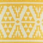 closer look at cushion cover with Gold Tribal pattern.