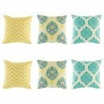 3 pairs of patterned cushion with chevron and ikat patterns in Yellow and Teal colours.