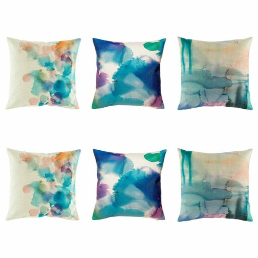 3 pairs of cushion with faded abstract patterns in blue.