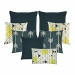 Two pieces of grey arrow patterned cushion, a pair of cushion with yellow, white and black triangle patterns, 3 grey coloured cushion and one rectangular cushion with triangle design
