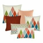 Three diamond design,one chevron, one plain and one zigzag design cushion covers in square and rectangular shapes in white and red colours.