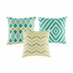 Three diamond and chevron patterns in teal and gold colours cushion cover.