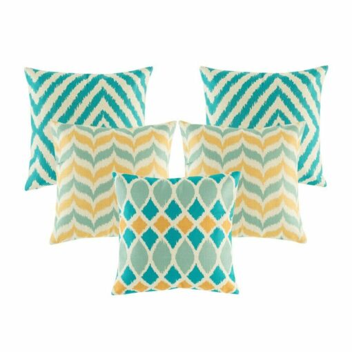 Five cushion in gold and teal colours with diamond and chevron designs.