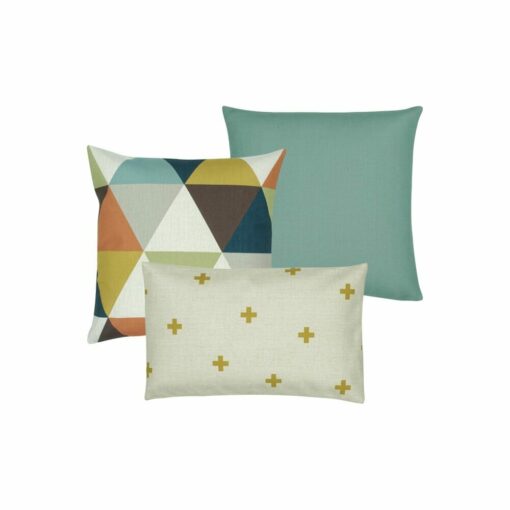 a cushion cover with triangular design, a plain teal cushion cover, and a gold and white cross patterned cushion cover