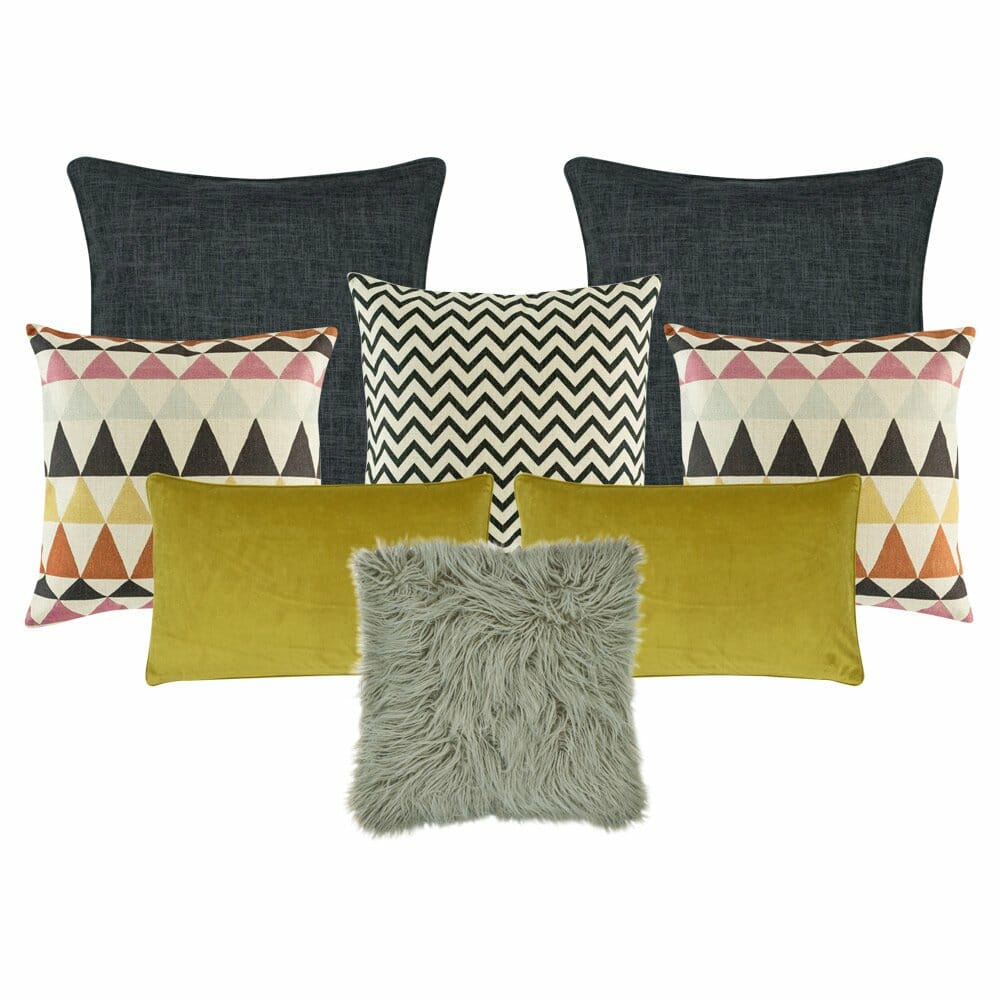 two plain grey cushion cover a pair of pink,grey and orange patterned cushion cover, a black and white cushion cover in black and white, a grey fur cushion cover, and two rectangular cushion cover in mustard