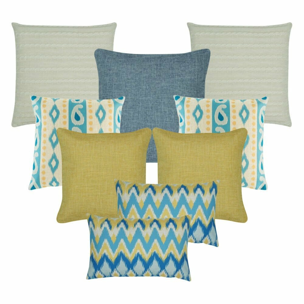 A pair of rectangular chevron design cushion, a pair of gold cushion, a pair of patterned cushion in gold and blue colours, one blue cushion and two cushion in cable knit design.