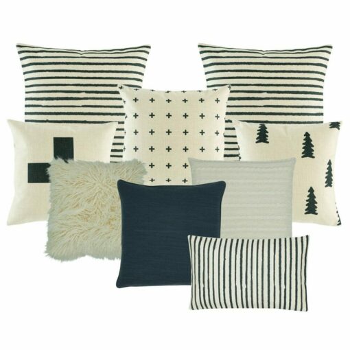 2 cushion with black and white stripes, 1 black and white with small cross design one plain white fur, one pine tree printed cushion, one plain white cushion, one plain dark grey cushion, one black and white with big cross cushion, and one rectangular cushion