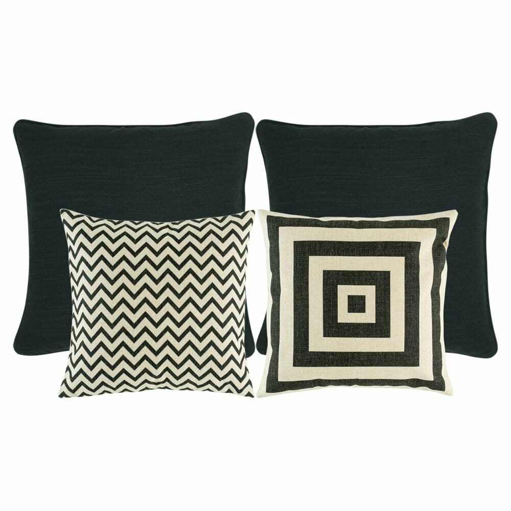 two pieces of plain black cushion, one chevron patterned cushion, and and one black and white cushion with square designs