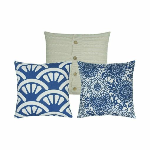 One cable knit with buttons cushion cover and two patterned cushion covers in blue and white colours.