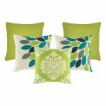 A pair of lime coloured cushion , a pair of teal, grey and lime patterned cushion , and one lime and white cushion