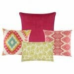 Three multi patterned cushion cover in fuchsia and yellow colours with rectangular leaf and diamond designs. One plain fuchsia cushion cover.