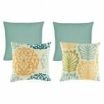 A pair of skyblue cushion and a pair of patterned cushion in skyblue and yellow colours.