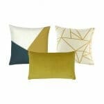 2 square cushion in muted gold with linear design, and one rectangle cushion.
