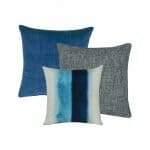 Two plain cushion in blue and grey and a blue and white patterned cushion