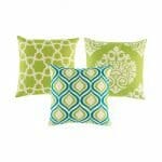 Two patterned cushion in lime green and white colours, and one patterned cushion in blue and lime green.