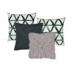 2 grey and white cushion cover with triangle designs, 1 plain grey cushion and one faux fur cushion in neutral color