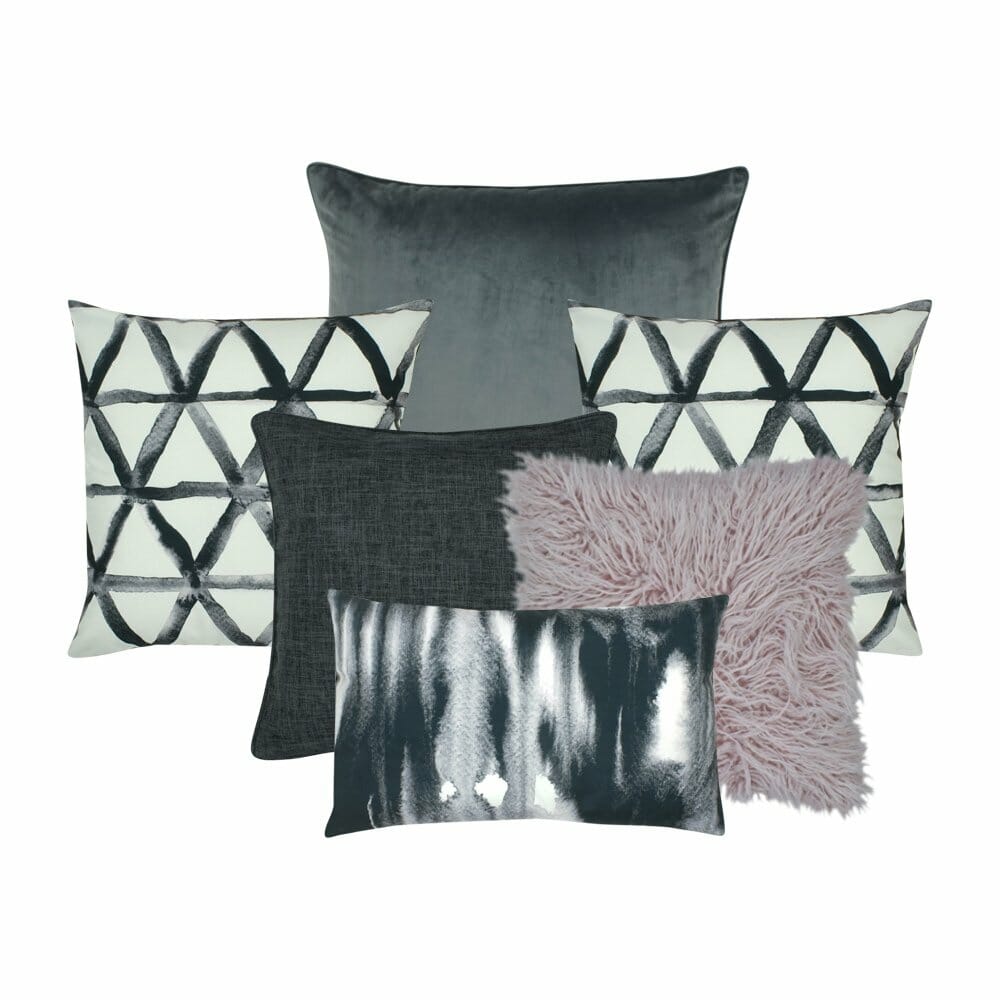 1 large cushion cover in dark grey, 2 triangular designed cushion cover , 1 fur cushion cover, one grey cushion cover and a rectangular cushion cover in white and grey