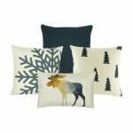 A plain grey cushion, 2 white and grey with snowflakes and pine trees design and one moose rectangular cushion cover