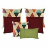 three multi coloured cushion, two plain dark red cushion, and 1 rectangular cushion in green