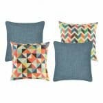 Two pieces of multicoloured cushion and two plain denim blue cushion