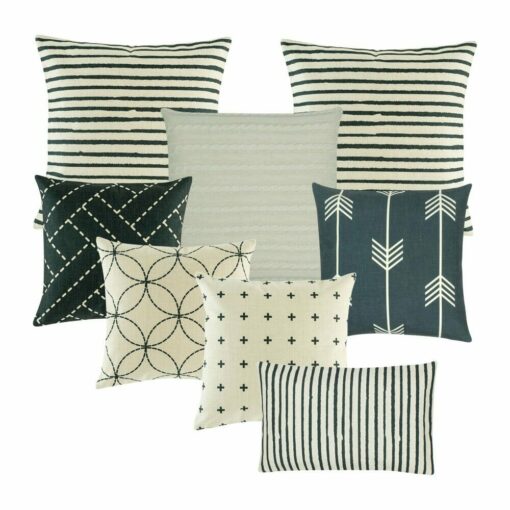 Two stripes cushion cover, one cable knit, 5 square cushion covers in multi patterned designs in white and navy colours.