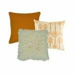 plain orange cushion cover, onec fur cushion cover and one arrow printed cushion cover