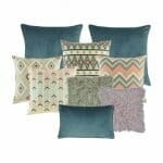 Two plain blue cushions covers, 4 cushion cover in different designs in pastel pink and blue, one grey fur cushion cover, one cushion cover in lilac and one blue rectangular cushion