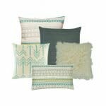 2 beautiful square cushion cover with a blue and white pattern a knitted cushion cover in grey, obe fur cushion cover in white, and one patterned rectangular cushion cover
