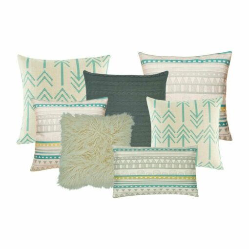 4 square cushion in patterned material, 1 knitted cushion in grey, a white fur cushion and one rectangular cushion in blue, white and teal.