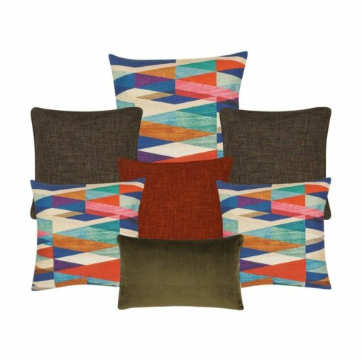 Two plain bron cushion, one burnt orange cushion, three cushion cover with patterns, and one brown rectangle cushion