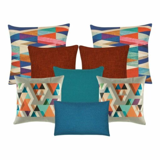 Two patterned cushion cover in multicolour, a pair of dark orange cushion cover, one teal cushion cover, two grey and orange with triangle design cushion cover and a blue rectangular cushion cover