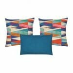 A pair of multicolored cushion and one blue rectangular cushion
