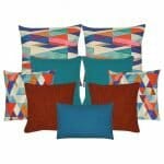 Two multi coloured cushion cover with diagonal patterns, a pair of teal coloured cushion cover, a pair of triangle patterned cushion cover, two plain dark orange cushion cover and one blue rectangular cushion cover