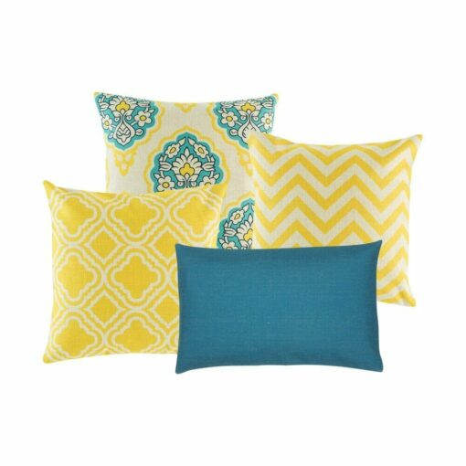 Two patterned cushion in white and yellow, one blue and yellow patterned cushion. and one rectangular blue cushion.