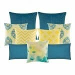 A pair of plain blue cushion, 5 multi patterned cushion cover in yellow, blue and white colours, and two plain rectangular cushion.