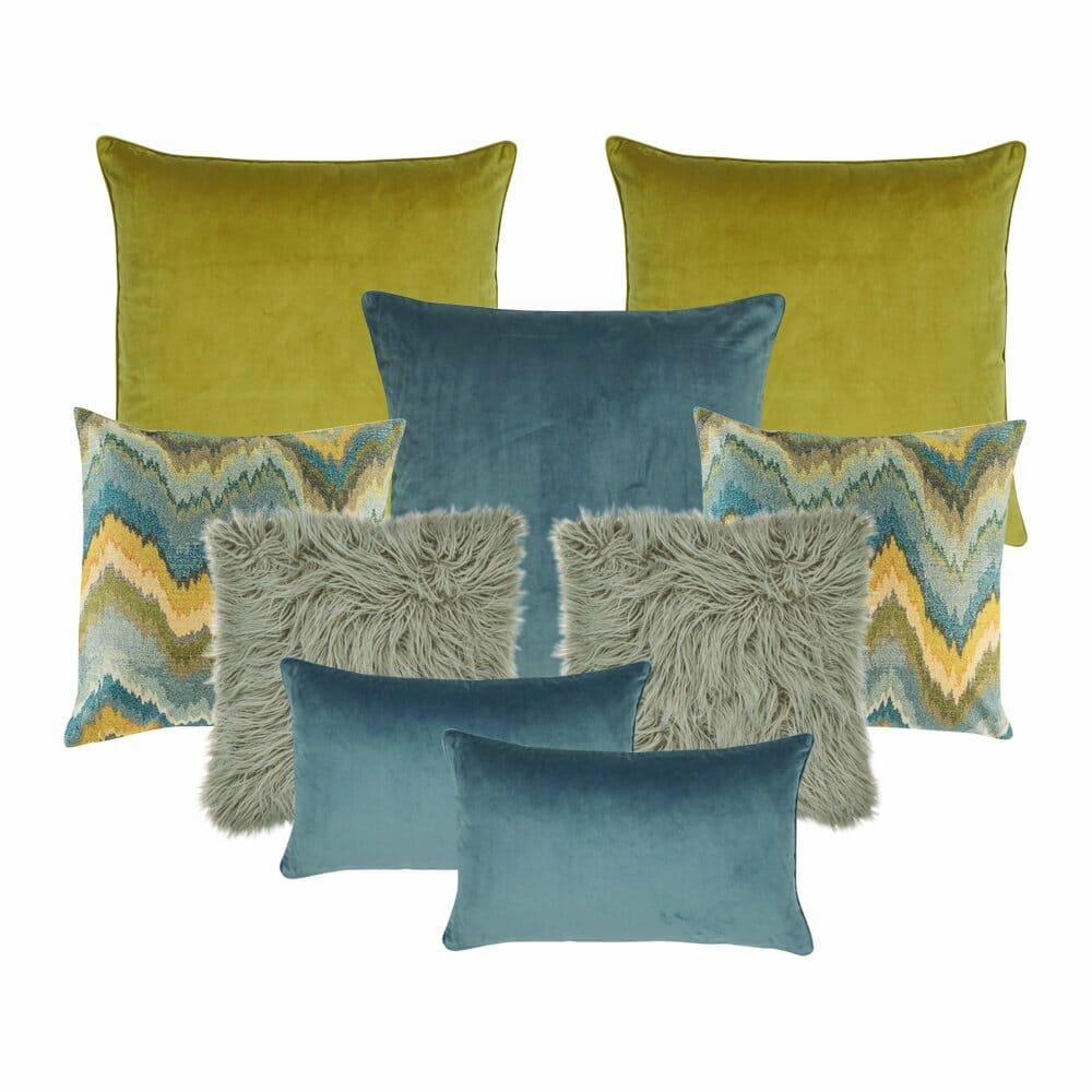 Two grey fur cushion covers, two cushion covers in yellow, one blue cushion, two chevron patterned cushion, and two blue rectangular cushion