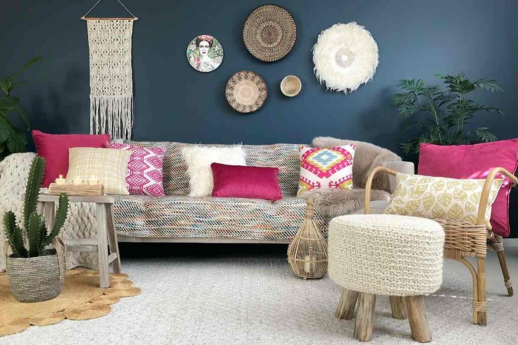Pink, white and yellow patterned and textured cushions in a bohemian inspired living room