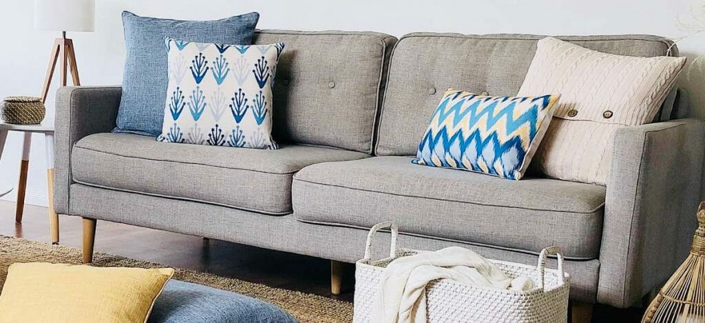 Blue and beige cushions to complete the beach inspired look of the living room.